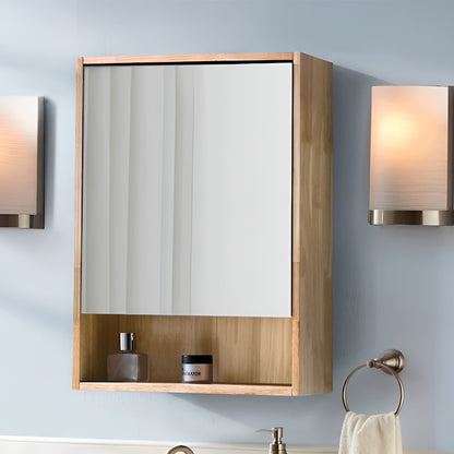 Wooden medicine cabinet with mirror and shelves on a light blue wall.