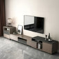 Modern TV stand with a television mounted on a wall in a room with marble flooring.