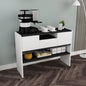 Coffee-making station on a white and black console table in a room with wooden flooring.