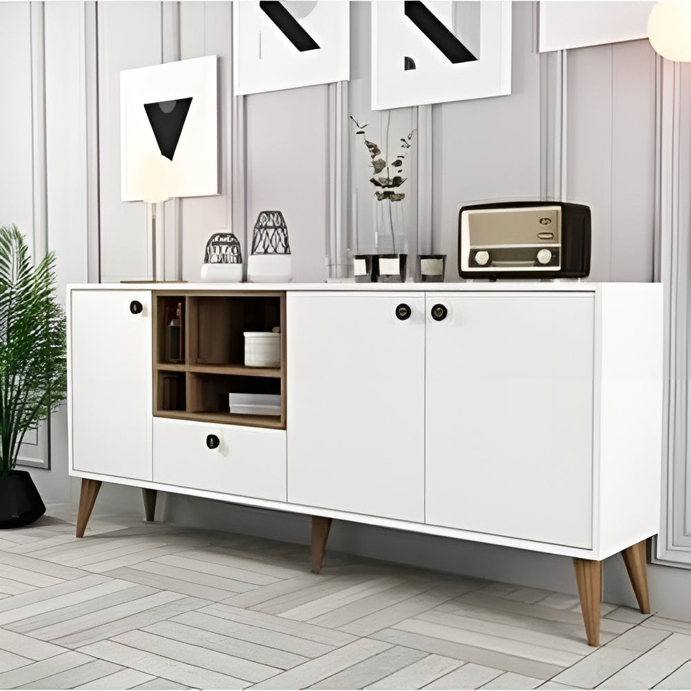 White sideboard with wooden legs in a room with decor elements.