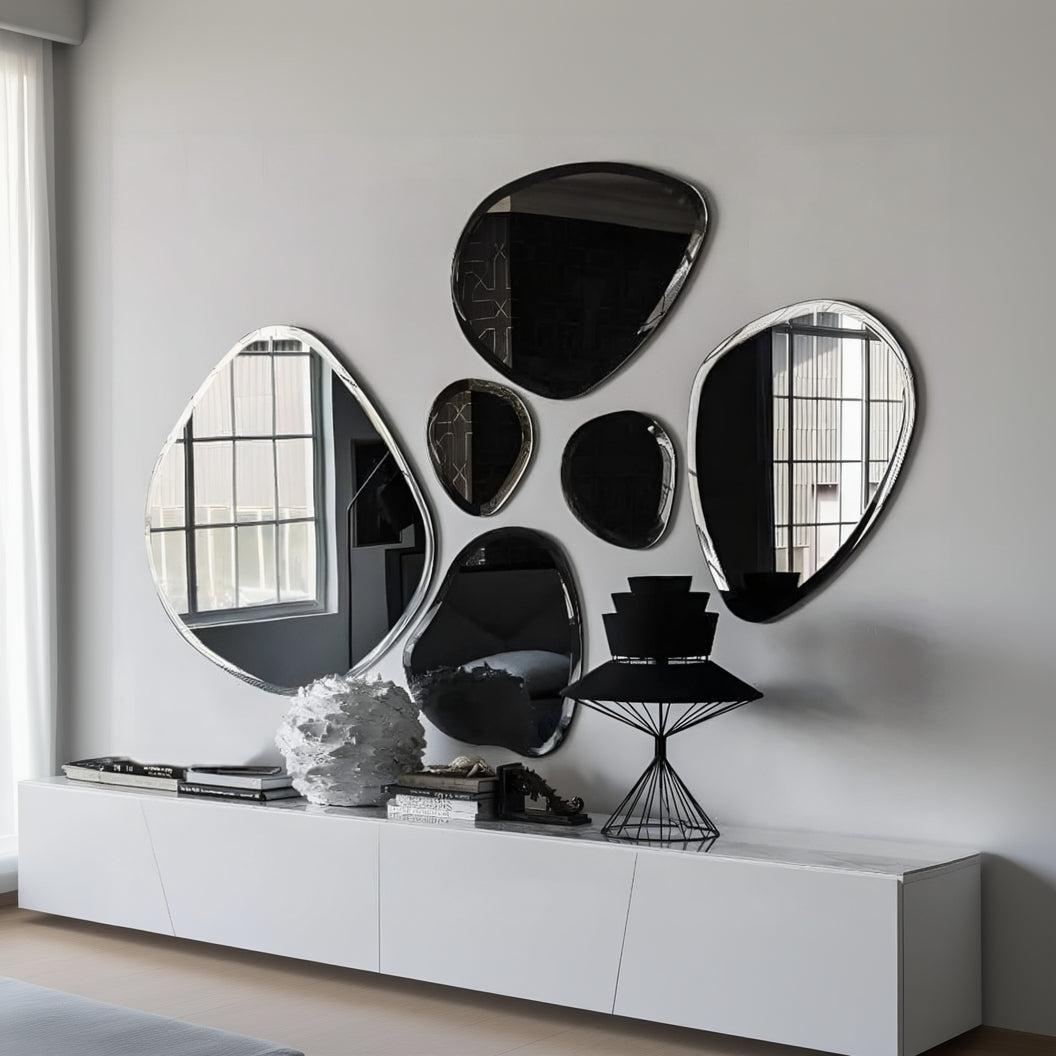 Modern wall mirrors with a geometric design on a light gray wall.