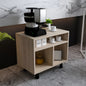 Coffee machine on a wooden side table with cups and a plant in a modern interior setting.