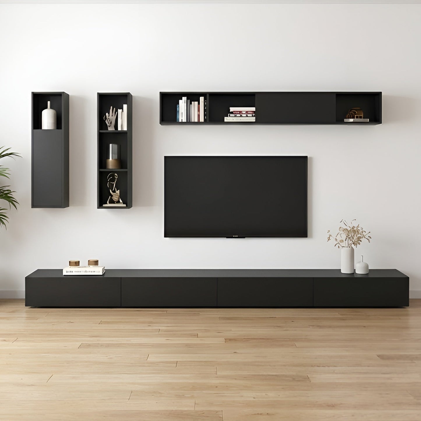 Modern living room with black entertainment unit, TV, and wall-mounted shelves.
