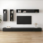 Modern living room with black entertainment unit, TV, and wall-mounted shelves.
