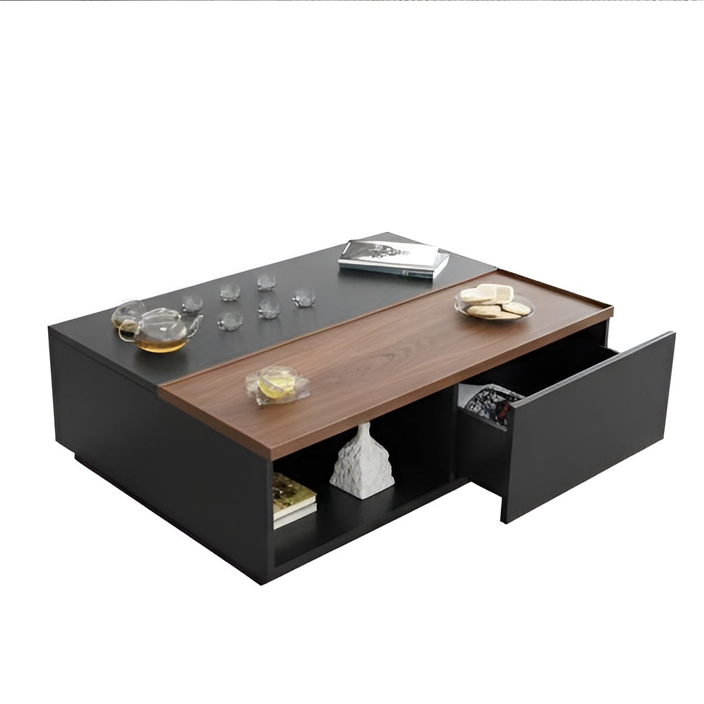 Modern coffee table with black top and wooden side, featuring decorative items.