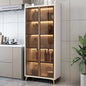 Modern kitchen with a glass-fronted cabinet displaying items.