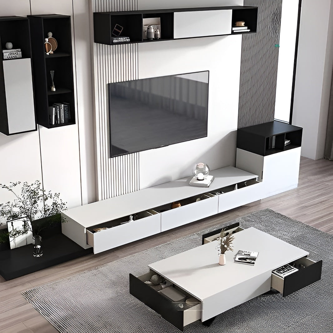 Modern living room with a white entertainment console, TV, and coffee table.