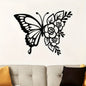 Butterfly and floral wall decal on a white wall above a sofa.