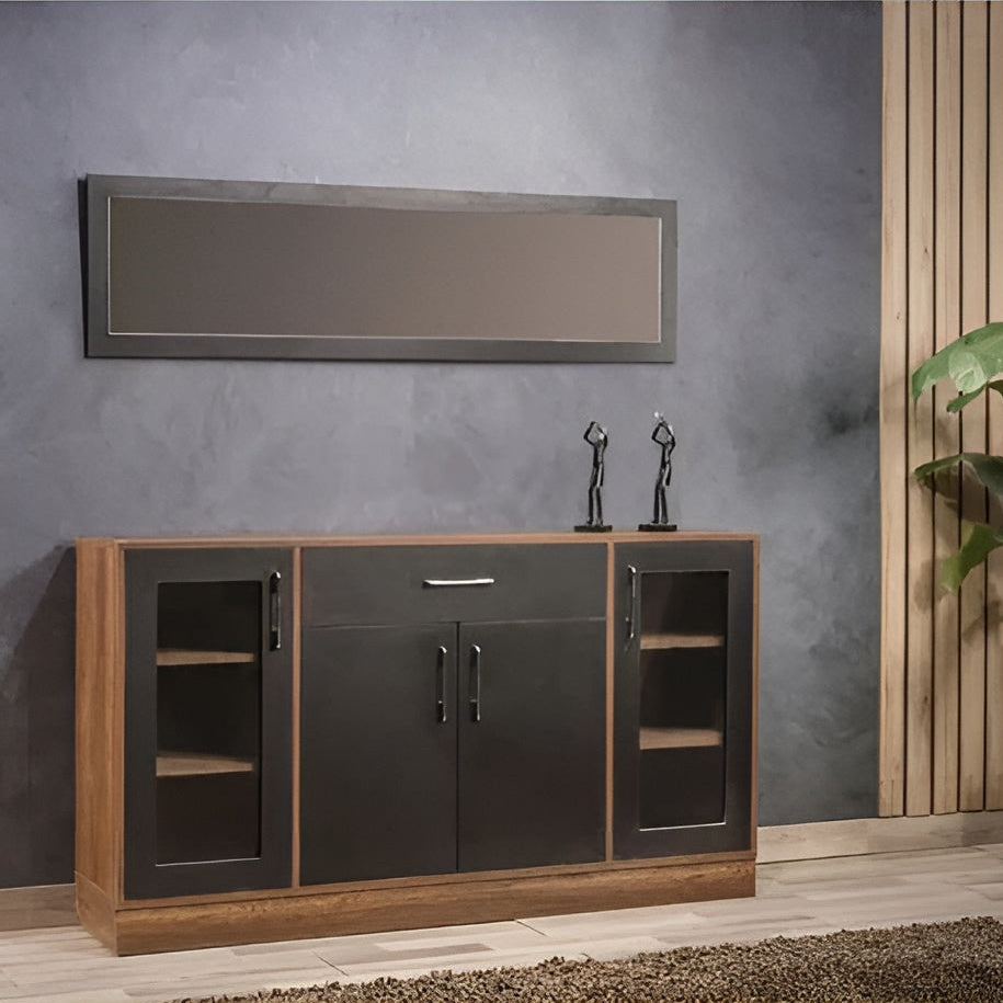 Wooden sideboard with black accents against a gray wall with a mirror.