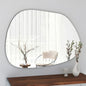 Round mirror on a wall with a chair and decorative items in the reflection