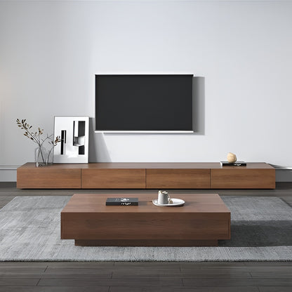 Modern living room with wooden TV stand and coffee table.
