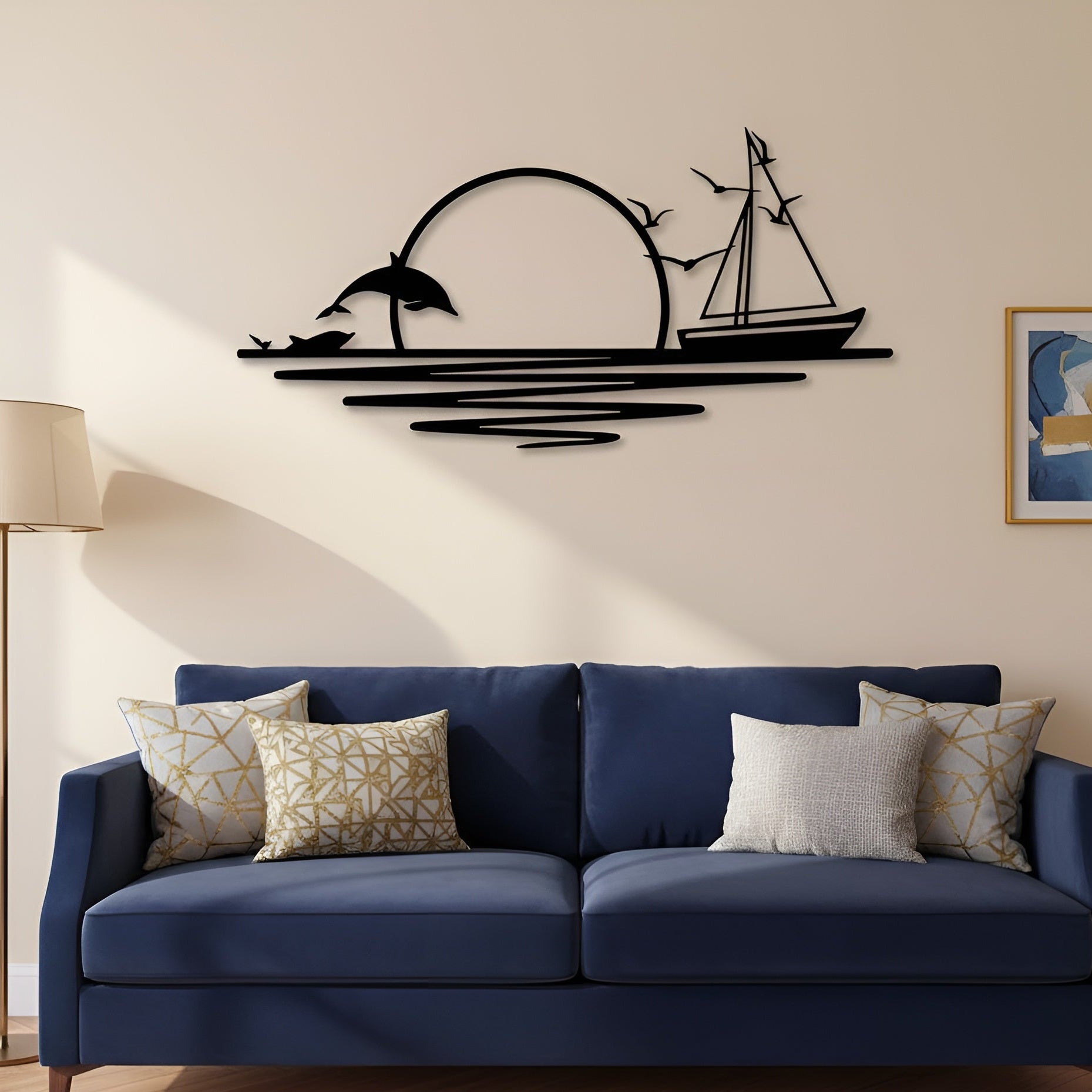 Navy blue sofa with decorative pillows in a room with a wall art piece of a sailboat and dolphin.