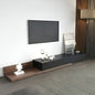 Modern living room with a black TV stand and wall-mounted TV.