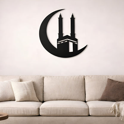 Decorative wall art of a mosque on a crescent moon above a beige sofa.