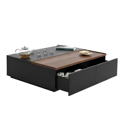 Modern coffee table with wooden top and black base, featuring tea set and books.