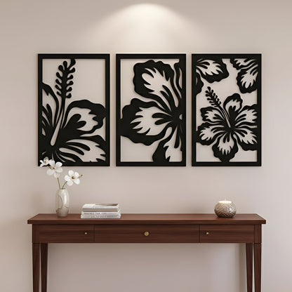 Decorative wall art with floral designs above a wooden console table.