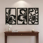 Decorative wall art with floral designs above a wooden console table.