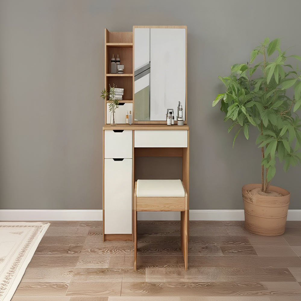 Wooden vanity with mirror and stool against a gray wall with a plant on a wooden floor.