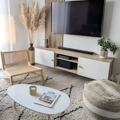 Modern living room with a TV stand, chair, and coffee table.