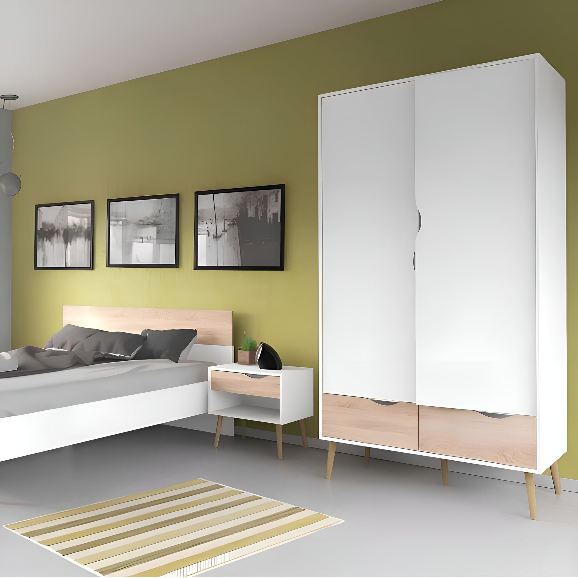 Modern bedroom with a bed, nightstand, and wardrobe against a green wall.
