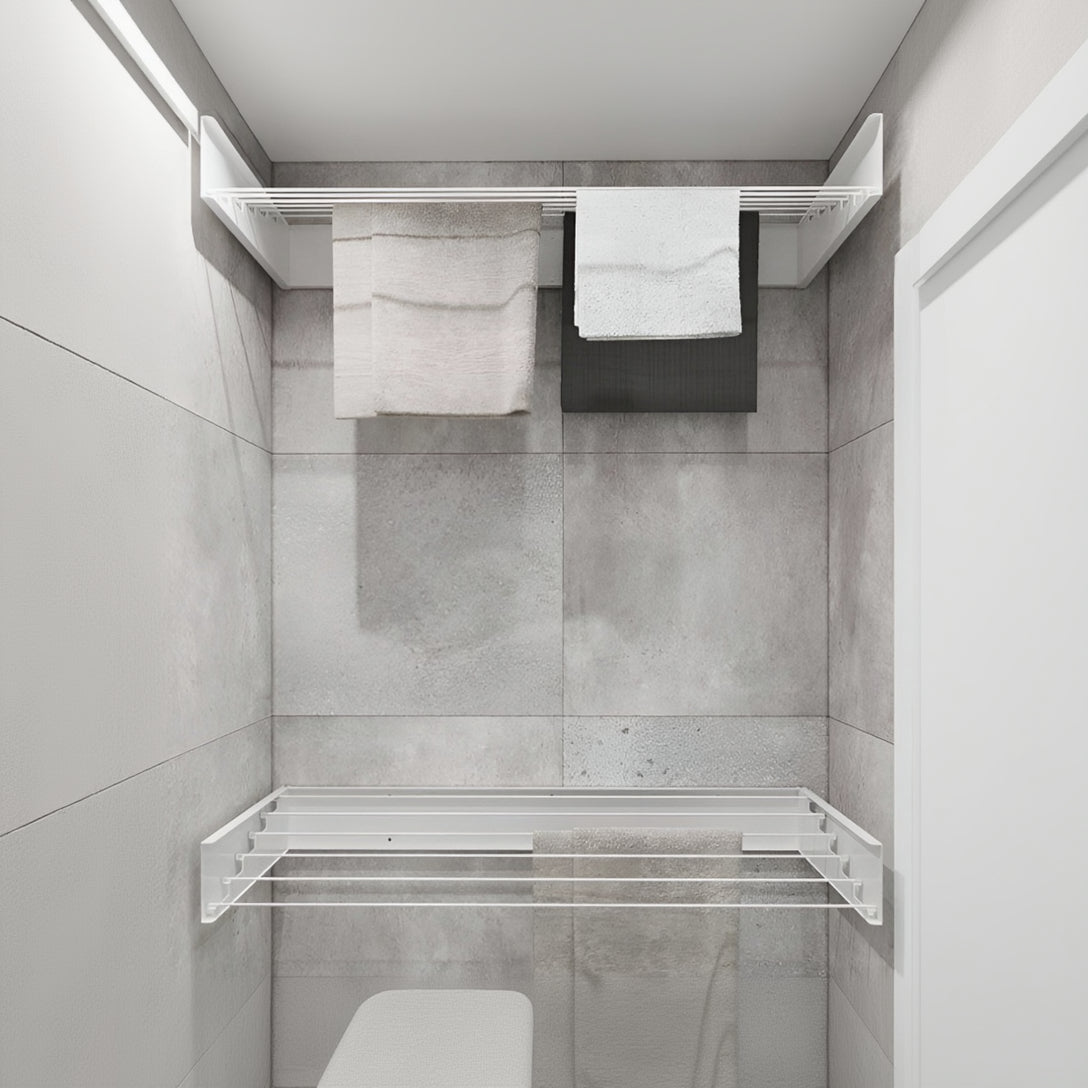 Modern bathroom with gray tiled walls, a towel rack, and a robot vacuum cleaner.