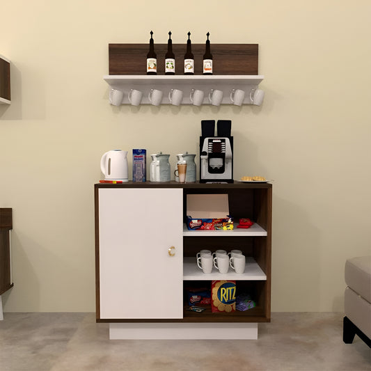 Small kitchenette with coffee maker, cups, and snacks on a beige wall.