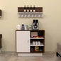 Small kitchenette with coffee maker, cups, and snacks on a beige wall.