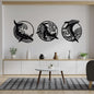Three black dolphin wall decorations on a white wall above a wooden console table with decorative items.