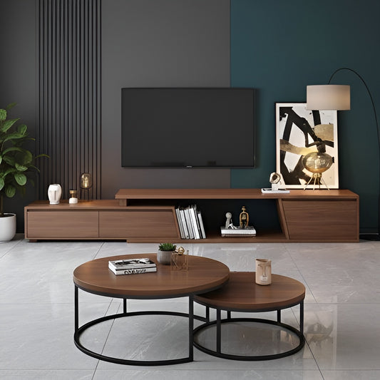 Modern living room with wooden TV stand, round coffee table, and decorative items.
