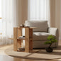 Modern living room with a beige armchair, wooden side table, and a small plant.