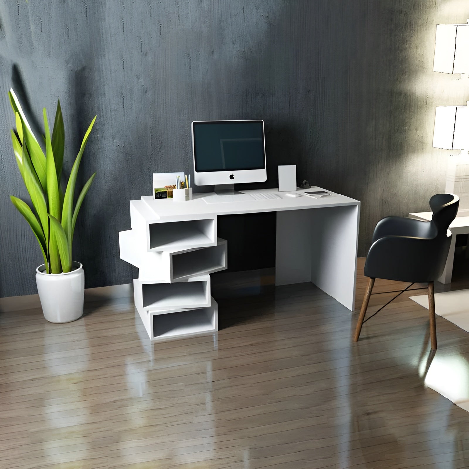 Modern office desk with computer setup in a room with a plant and chair.
