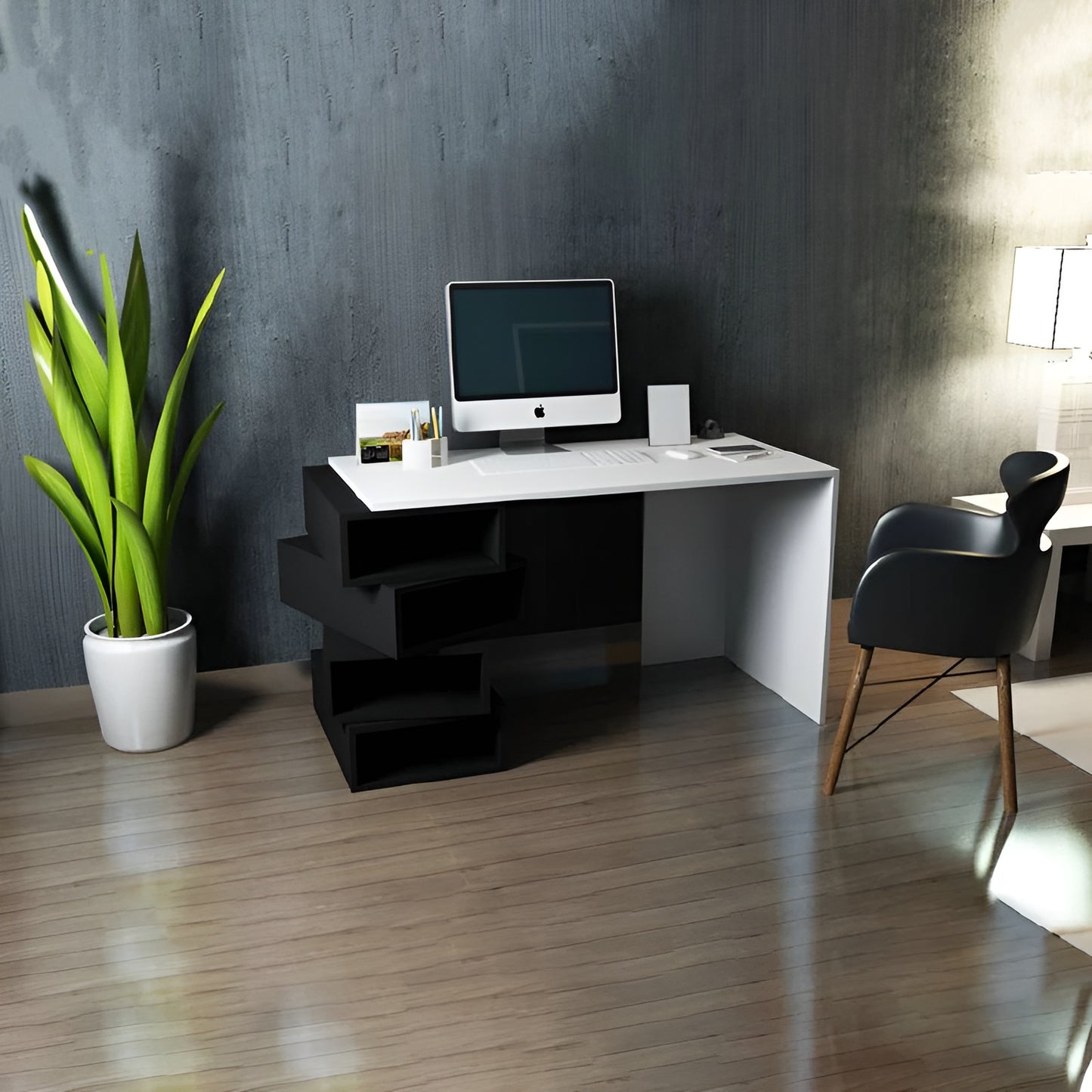 Modern office desk with computer setup in a room with a plant and chair.
