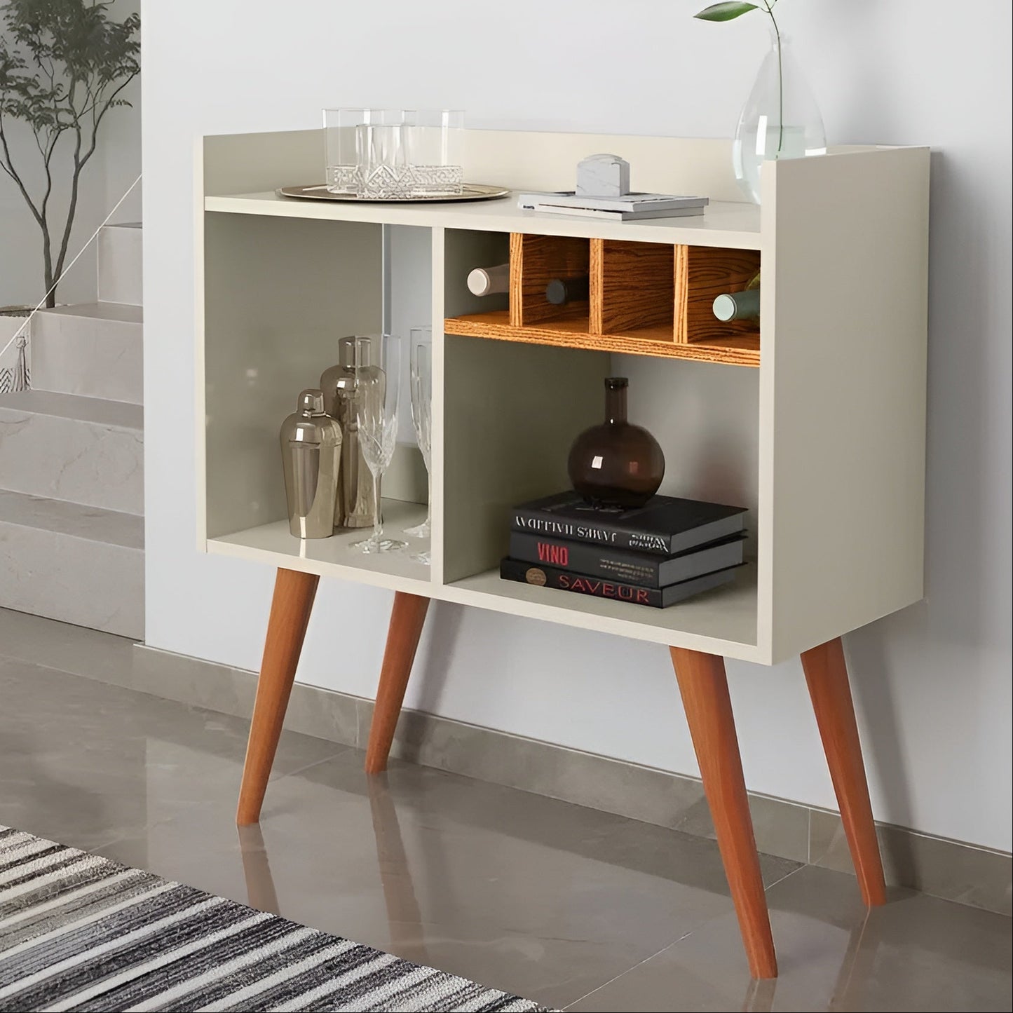 Modern sideboard with wooden legs in a room with a staircase and mirror.