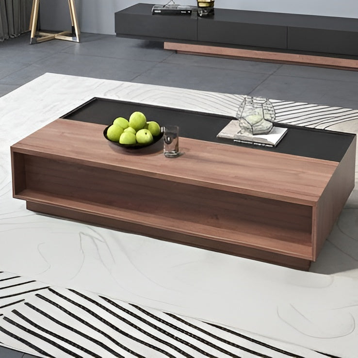 Modern coffee table with wooden finish and black top in a living room setting.