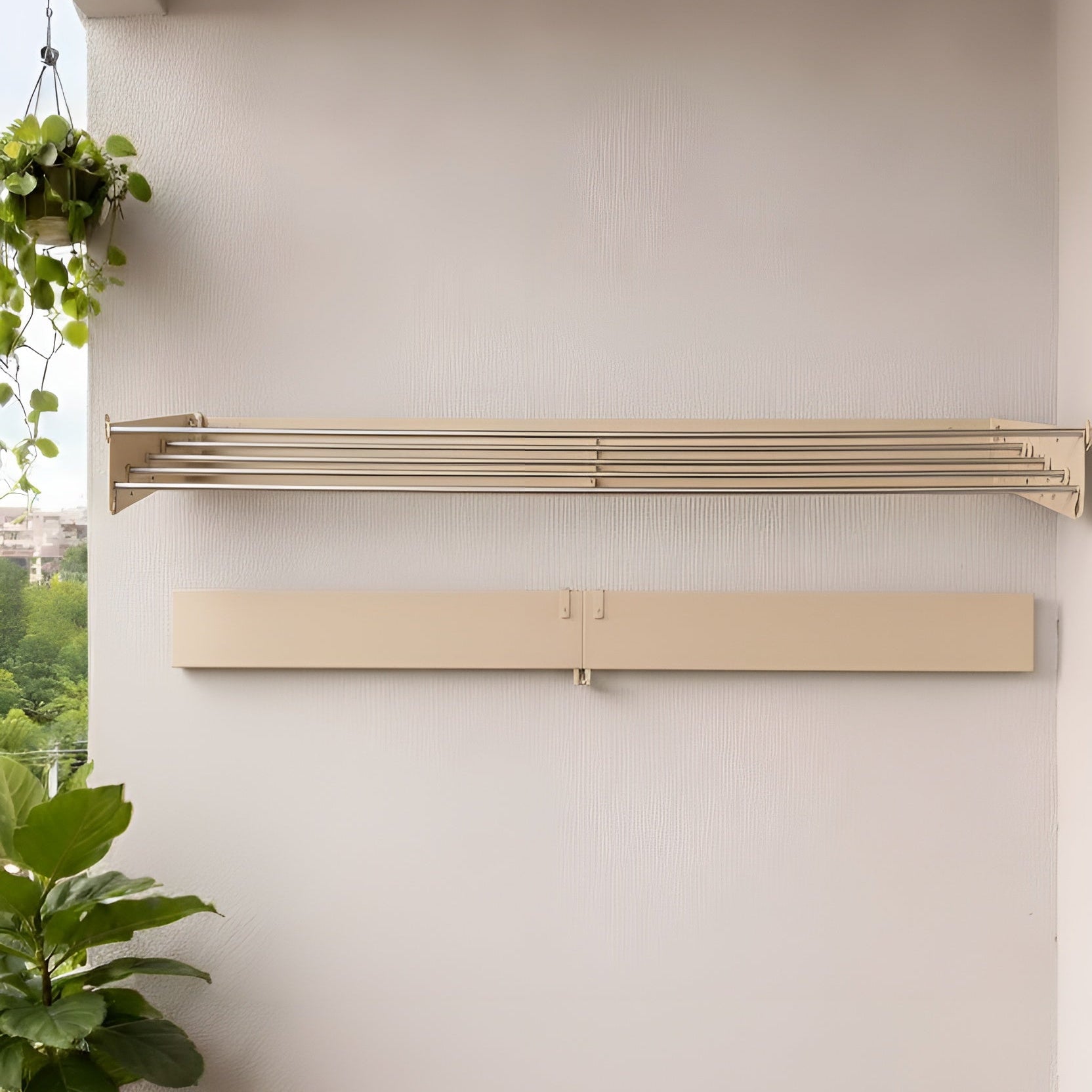 Wall-mounted radiator on a white wall with potted plants below