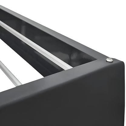 Close-up of a black metal frame with horizontal bars on a white background