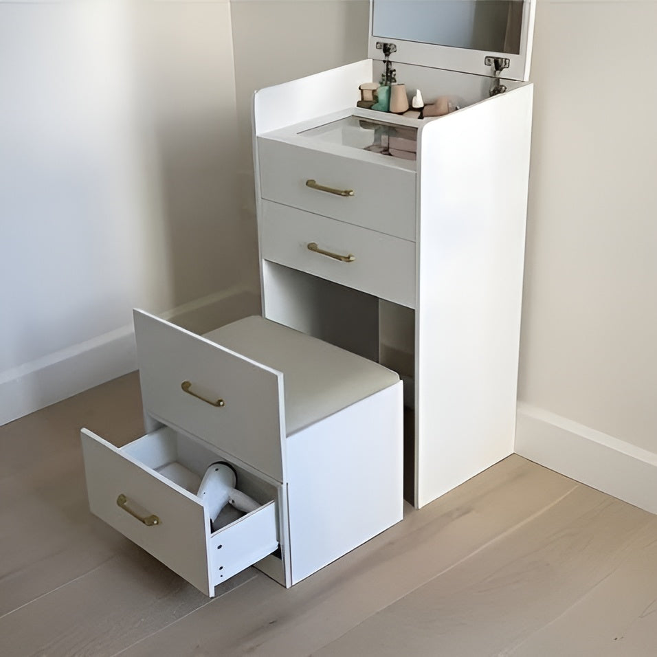 White vanity unit with step stool and open drawers in a bathroom setting