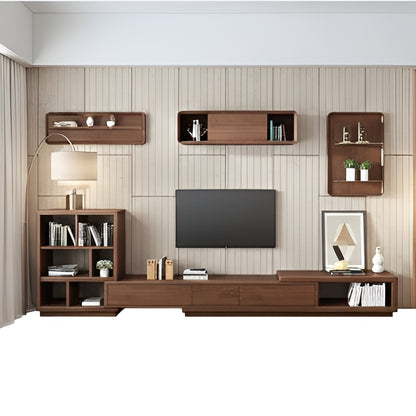 Wooden entertainment center with shelves and a TV in a living room setting.