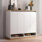 White shoe cabinet with wooden accents in a room setting.
