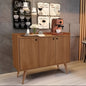 Wooden cabinet with coffee-themed decor in a room with gray tiled walls and wooden floor.