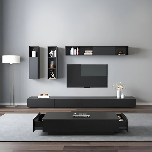 Modern living room with black entertainment unit, TV, and shelves against a gray wall.