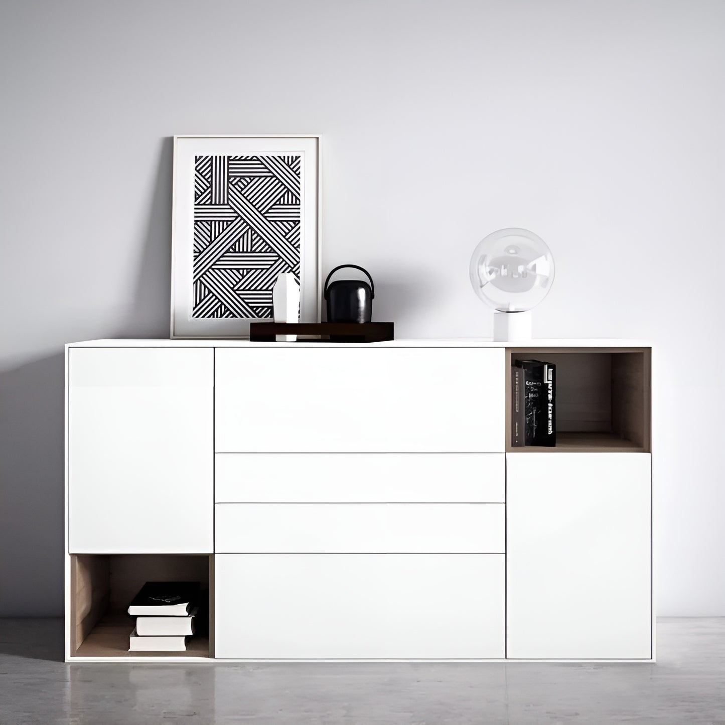 White sideboard with decorative items against a gray wall