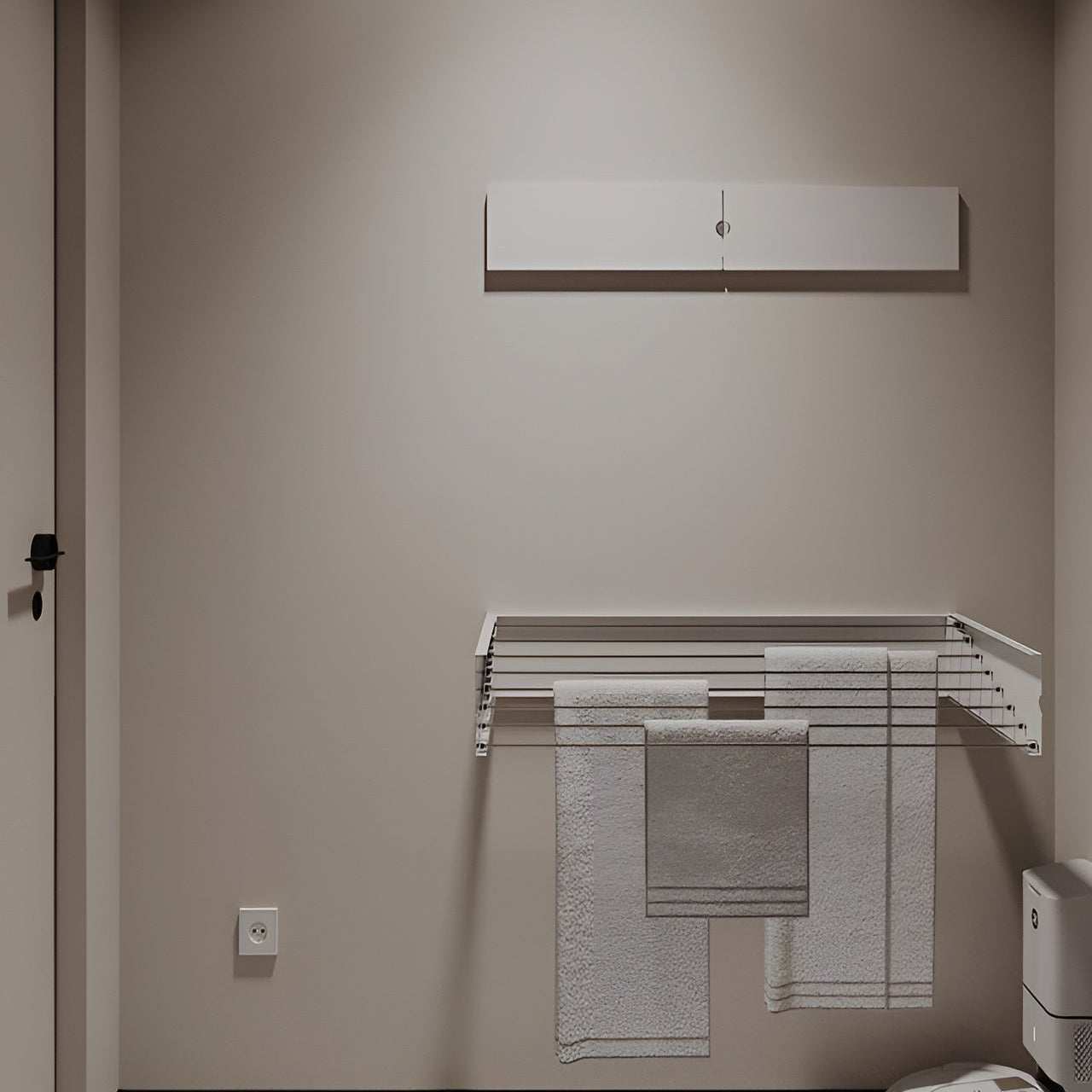 Modern bathroom with a towel rack and toilet.