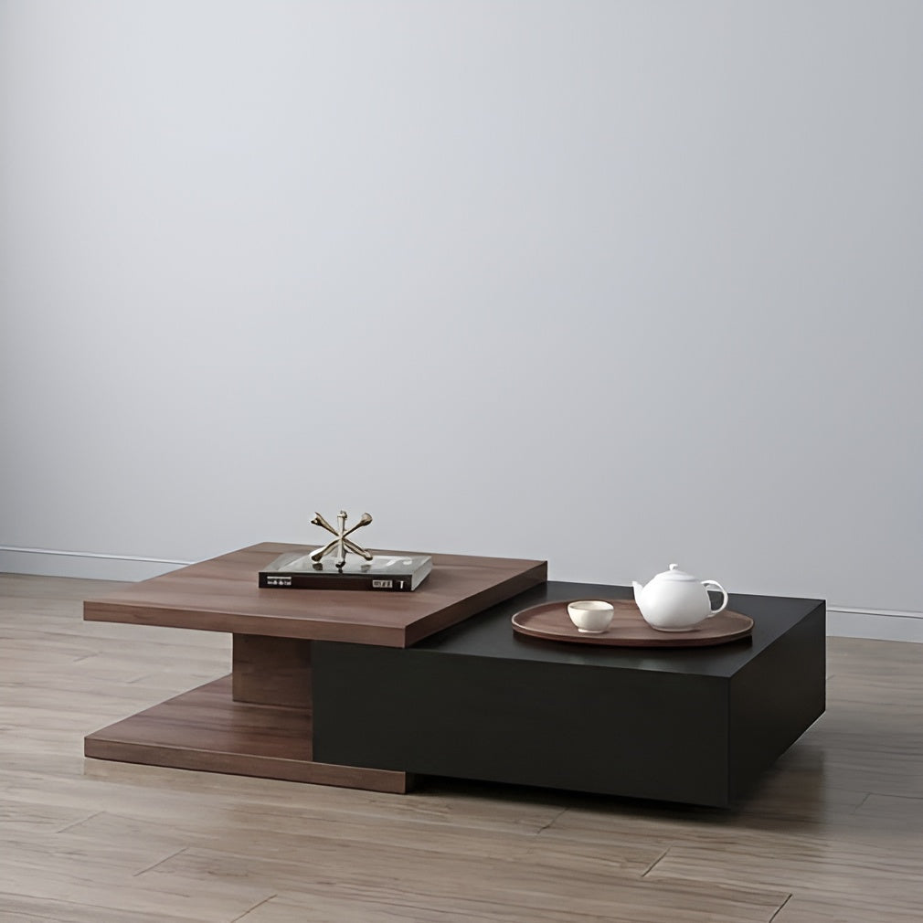 Modern coffee table with wooden and black design, featuring a teapot and decorative items on a plain background.