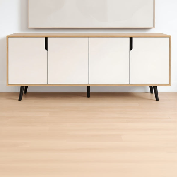 Wooden sideboard with white doors on a wooden floor and white wall background