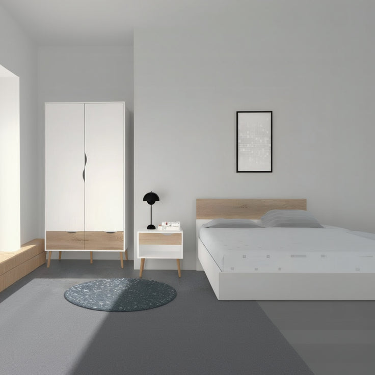 Modern bedroom with white wardrobe, nightstand, and bed against a gray wall.