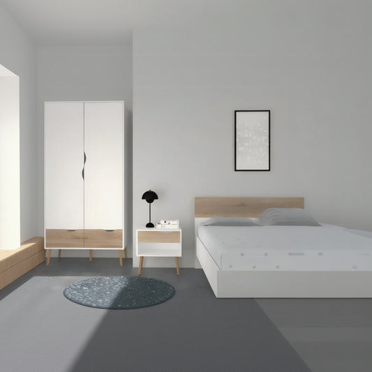 Modern bedroom with white wardrobe, nightstand, and bed against a gray wall.