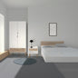 Modern bedroom with white wardrobe, nightstand, and bed against a gray wall.