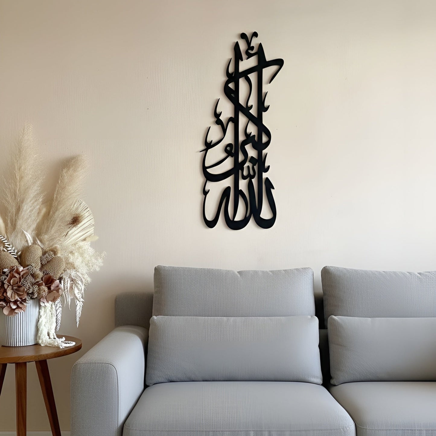Decorative wall art above a gray sofa in a living room setting.