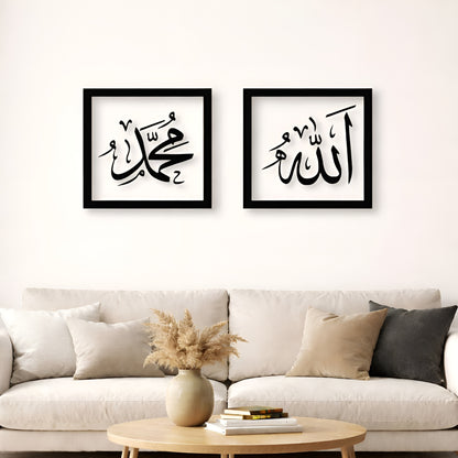 Two framed pieces of calligraphy art on a wall above a sofa.